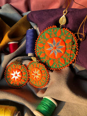 Handmade Embroidered Circular Necklace With Orange and Green Thread