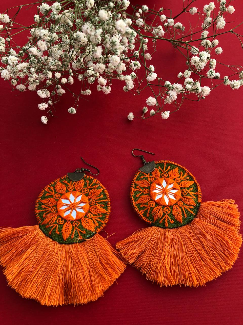 Handmade Embroidered Earrings With Green And Orange Thread