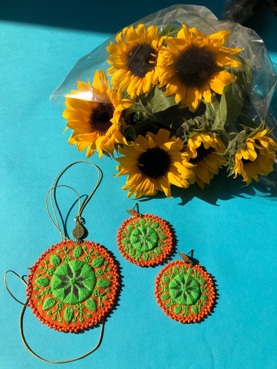 Handmade Embroidered Circular Necklace With Green and Orange Thread