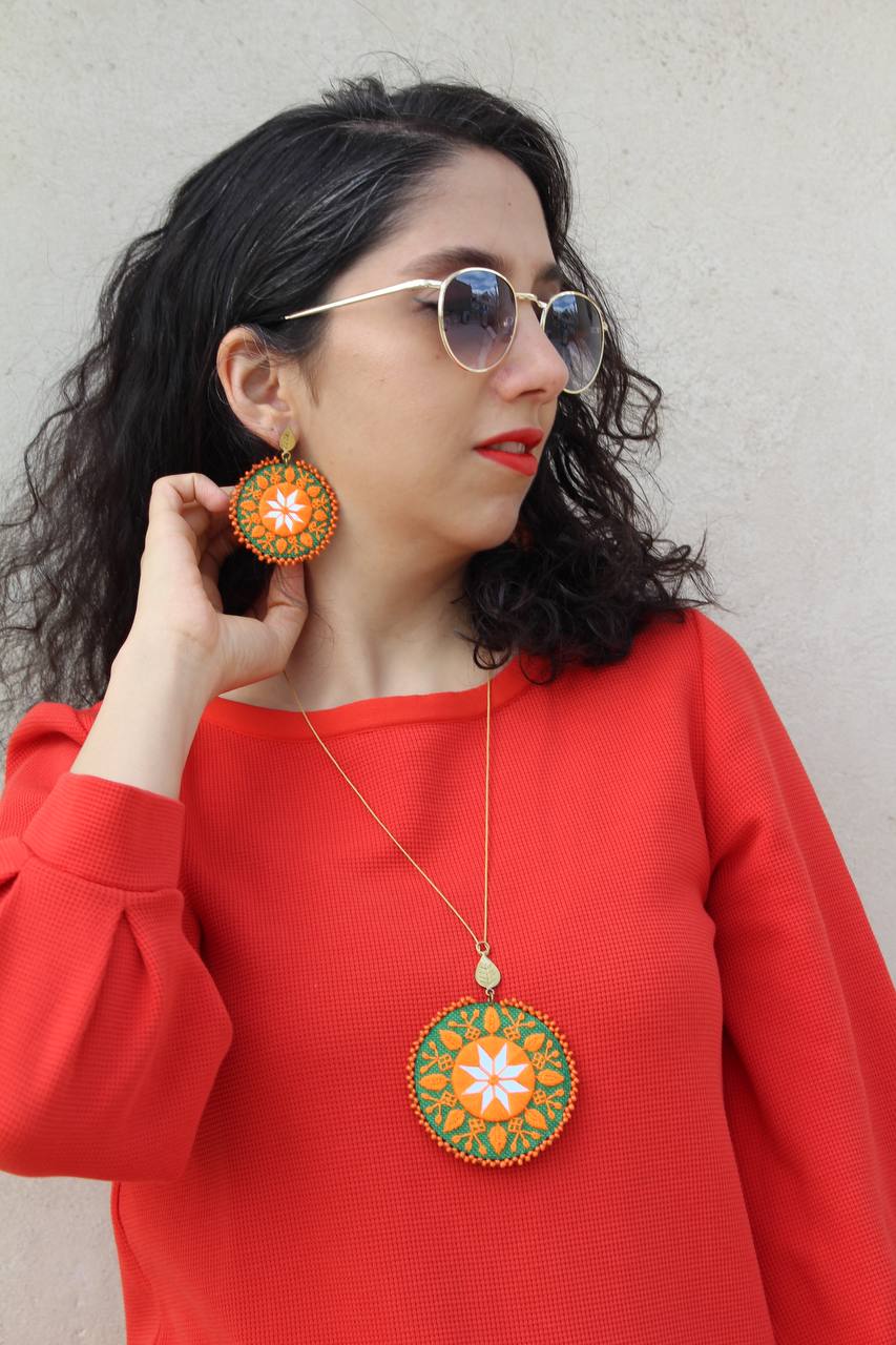Handmade Embroidered Circular Earrings With Orange And Green Thread