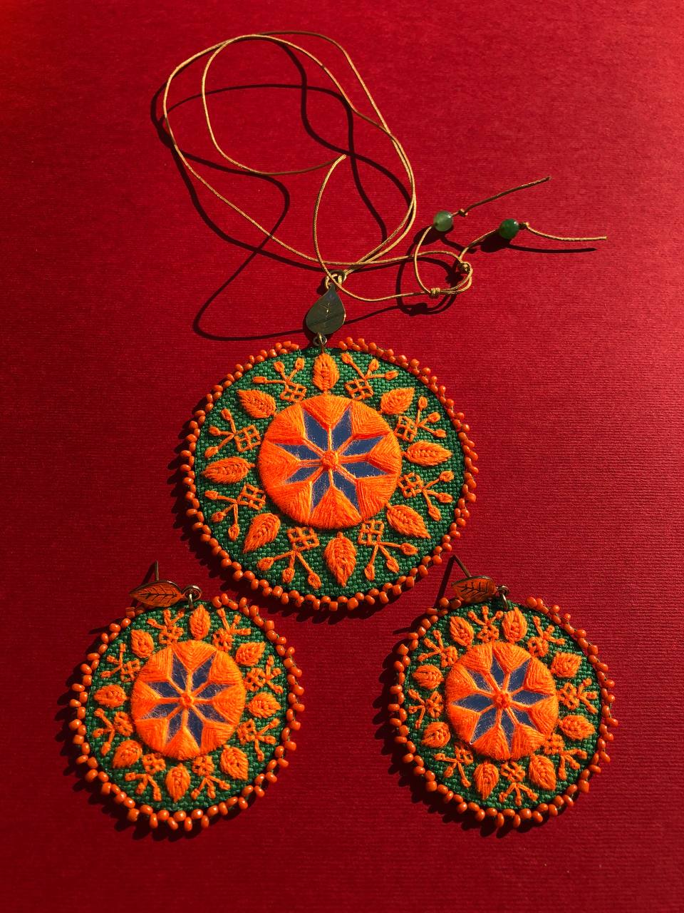 Handmade Embroidered Circular Necklace With Orange and Green Thread