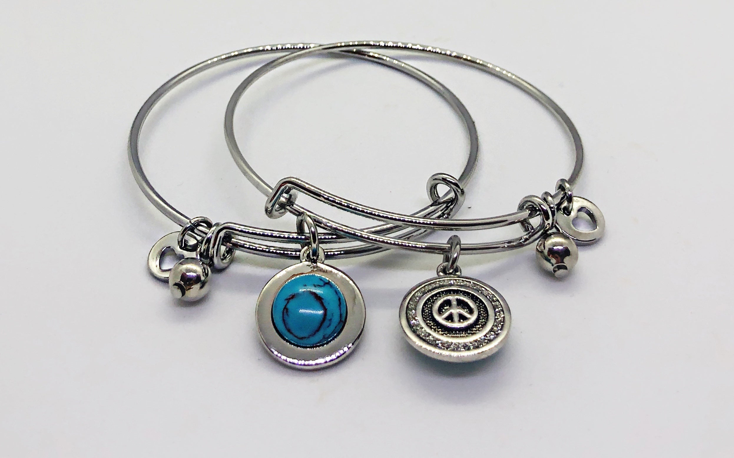Silver double side bangle with blue stone