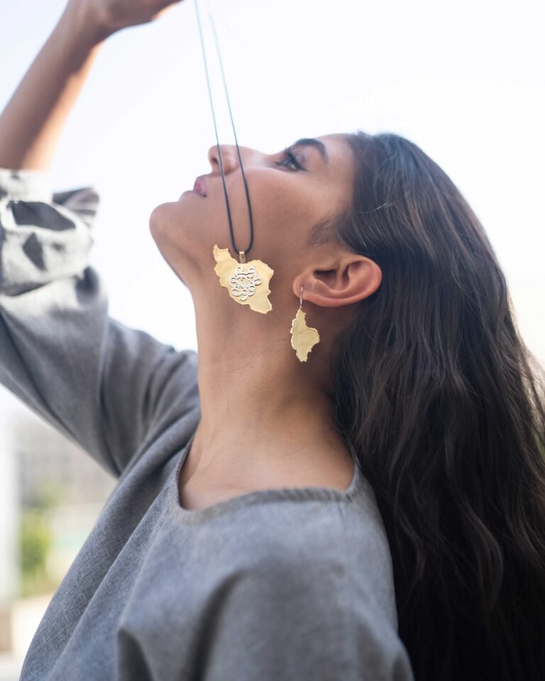 “Vatan” Necklace from the Homeland Collection-a handmade unisex pendant crafted from silver and brass, featuring unique typography and a leather strap. This piece celebrates the story of the motherland and timeless cultural identity.