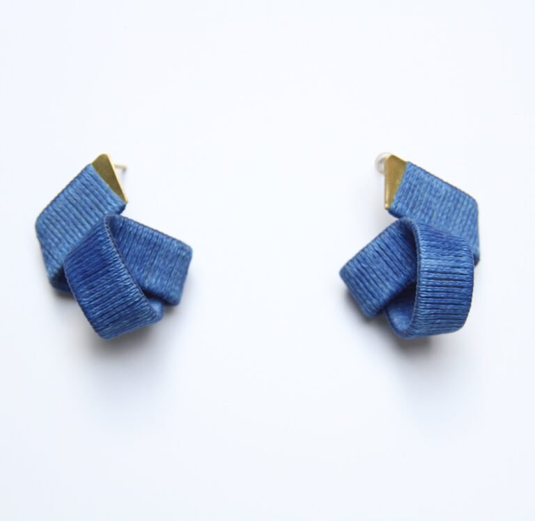The Joy Navy Blue Earrings (Small Size) are elegant and versatile accessories designed to add a subtle yet sophisticated touch to your everyday style. Featuring a deep navy blue hue, these petite earrings capture the essence of calm, confidence, and timeless beauty. Carefully handcrafted, the earrings are lightweight and comfortable for all-day wear. Their small size makes them an ideal choice for those who prefer minimalist jewelry that still makes a refined statement. The rich navy blue color pairs effortlessly with a variety of outfits, from casual daywear to evening attire, offering a versatile accessory for any occasion. The Joy Navy Blue Earrings embody a joyful spirit and understated elegance, perfect for layering with other pieces or wearing solo for a clean, polished look. Whether you're treating yourself or gifting a loved one, these earrings make a thoughtful and stylish addition to any jewelry collection. Add a touch of serene sophistication to your ensemble with the Joy Navy Blue Earrings (Small Size), designed to celebrate individuality, grace, and artistic craftsmanship.