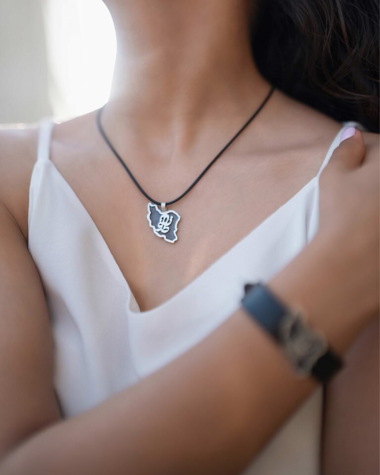“Zan-Vatan” Necklace from the Homeland Collection-a handmade unisex silver Necklace piece with unique typography and a leather strap. Inspired by Nizar Qabbani’s poetry, it beautifully connects the essence of womanhood and homeland.