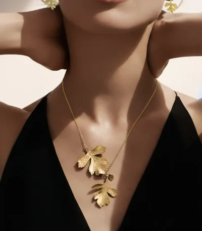 handmade necklace and earrings with two natural leaves