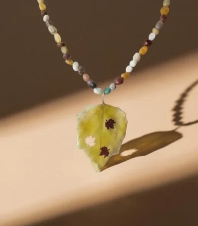 Handmade necklace with real fall leaf pendant and natural Mookaite gemstone beads, autumn-inspired jewelry design