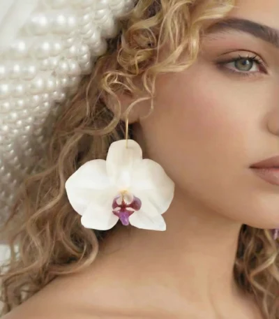 Handmade Real Orchid Earrings With Silver Hoop on model