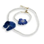Handmade demi set of necklace and bracelet with real blue hydrangea flowers preserved in UV resin, tubular white shell beads