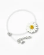 “Minimalist daisy flower choker with a transparent cord and silver clasp, featuring a real dried daisy preserved in resin