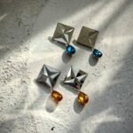 Charao – A Geometric Earring, Crafted from Mirror, Pulp, and Gemstone