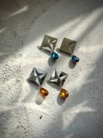 Charao – A Geometric Earring, Crafted from Mirror, Pulp, and Gemstone