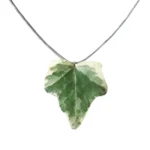 Handmade ivy leaf necklace with silver lame cord and stainless steel clasp on neutral background