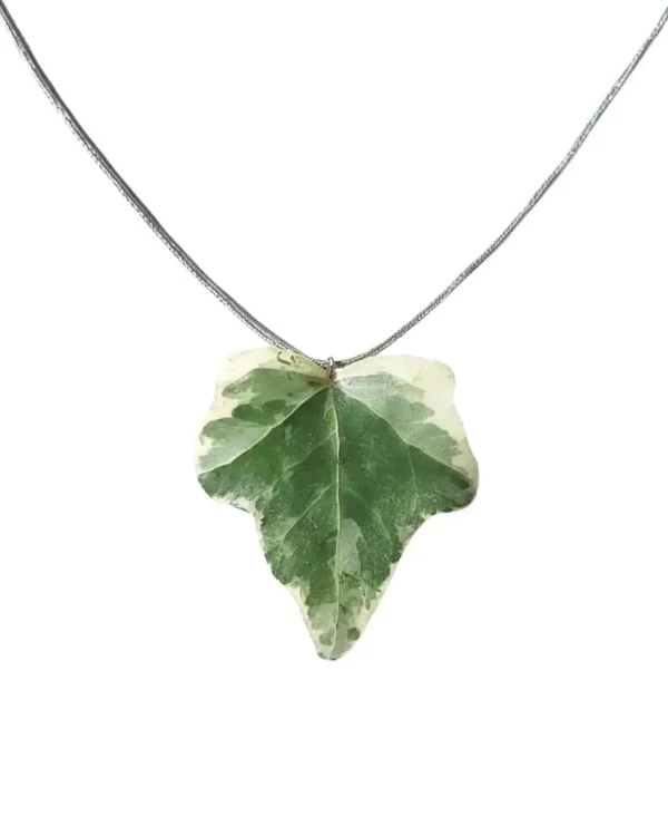 Handmade ivy leaf necklace with silver lame cord and stainless steel clasp on neutral background
